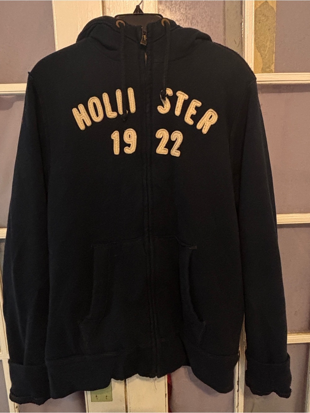 Hollister Navy Zip Front Hoodie with Cream Applique